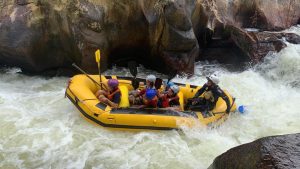 Group of young people at The Wave white water rafting.