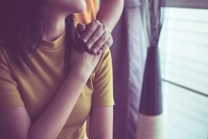 Close up image of a mother holding hands with mother