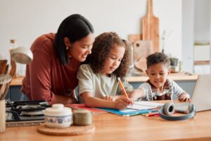 Homeschool, education and distance learning for children while mother, parent and woman helps son