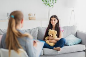 teen girl having consultation with psychologist