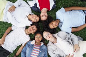 Group of teenagers lying together - Child and Adolescent Mental Health in Mexico