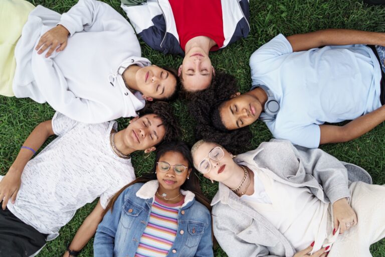Group of teenagers lying together - Child and Adolescent Mental Health in Mexico