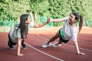 Teenagers exercising together - Over-Exercise - How Much Is Too Much for Teens
