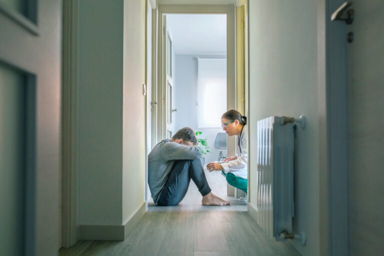 Psychiatrist talking to patient that may have done self harm