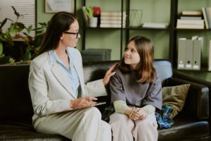 Professional Counseling Session between therapist and a teeenager