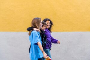 Young diverse friends walking on the street